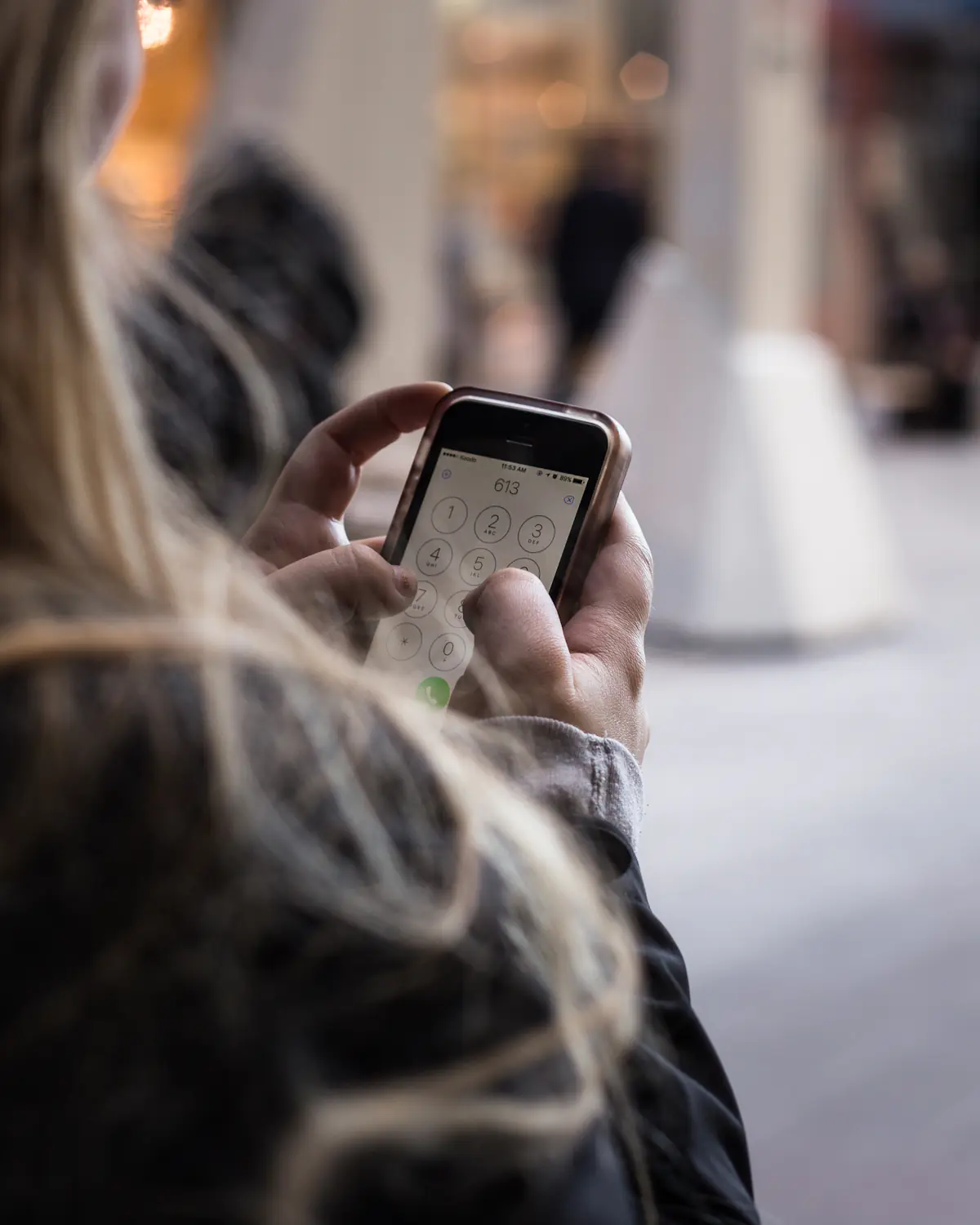 A customer reading a message on their phone